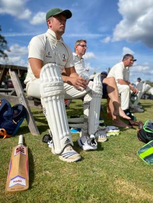 cricket players sitting down
